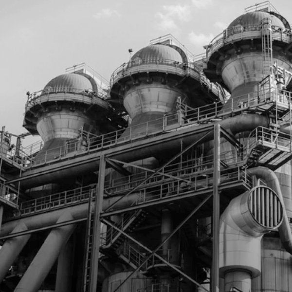 exterior black and white photo of mass-produced wine making facility