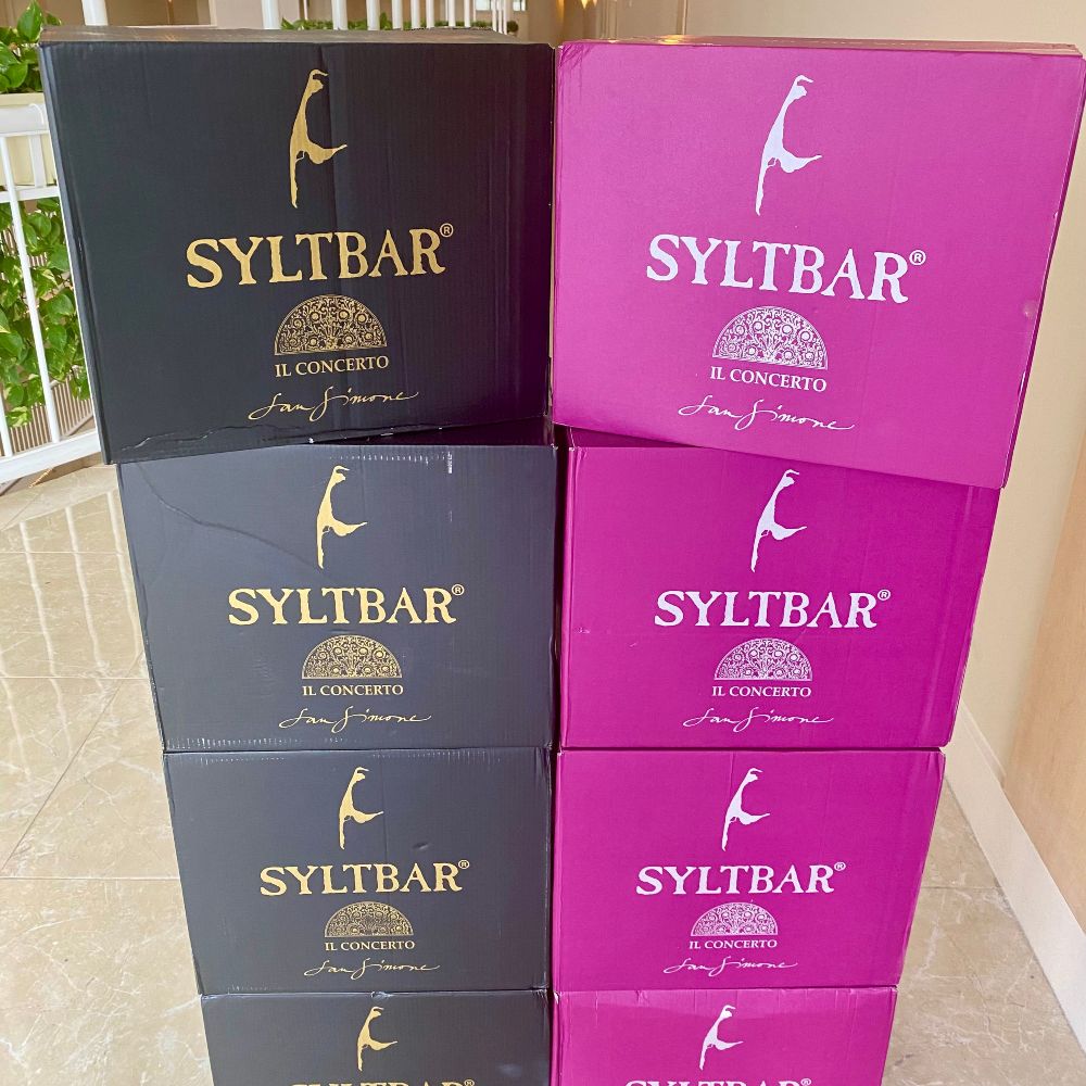 stacked boxes of Mr SYLTBAR premium low-sugar prosecco and Mrs SYLTBAR low-sugar sparkling wine
