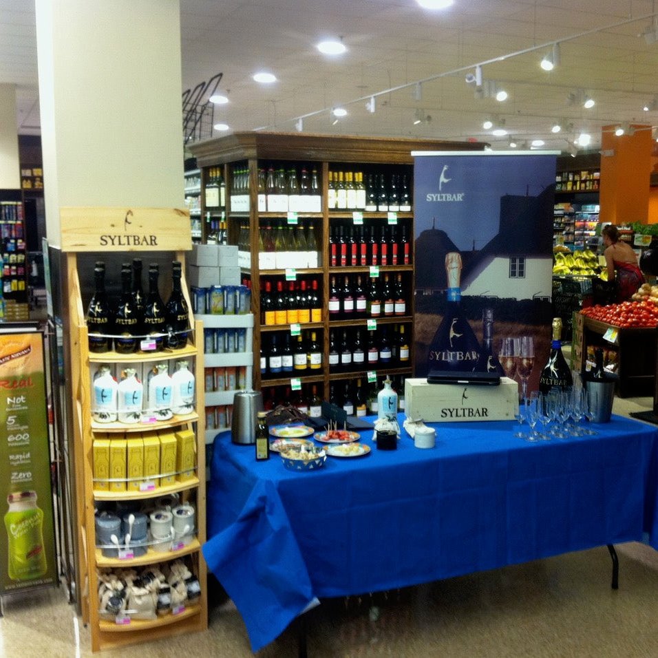 Photo of a table at Milams Market displaying SYLTBAR products