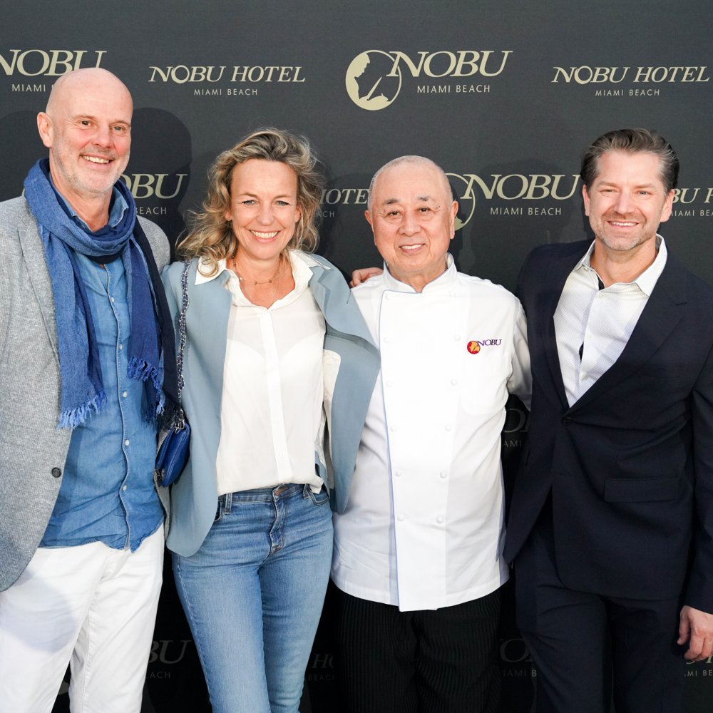 photo of SYLTBAR owners Regina and Claus with chef Nobu Matsuhisa at an event for Nobu in Miami Florida